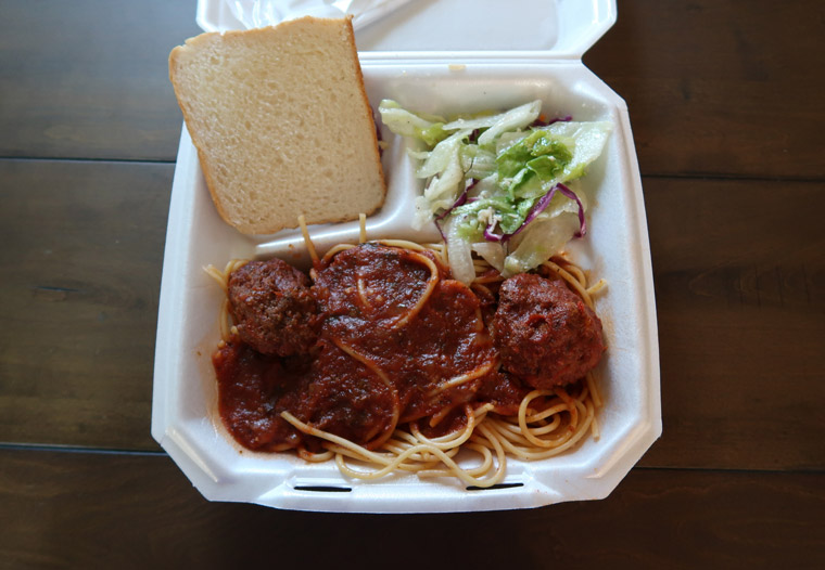 photo of spaghetti dinner in to-go plate to signify tips for running this type of school fundraiser