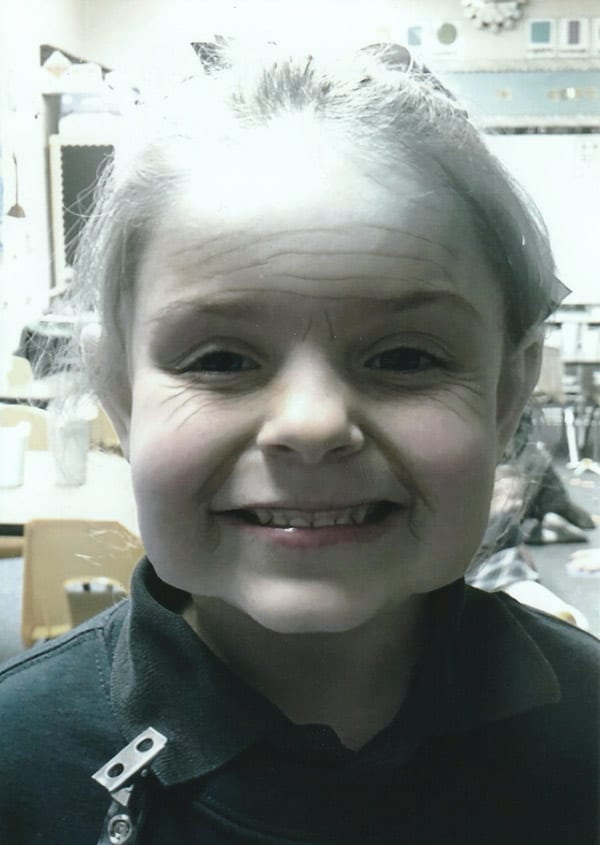 kindergartener with camera filter to make her look 100 years old