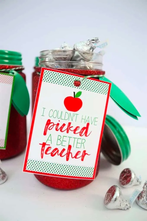 Red jar filled with chocolates to be given as a teacher appreciation gift with a tag that says "I Couldn't Have Picked a Better Teacher"
