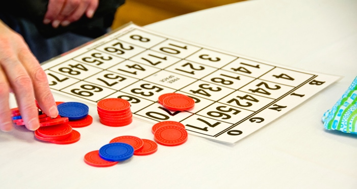 bingo card with red and blue bingo covers signifying a back to school bingo event