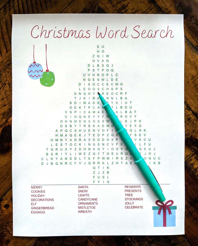 Christmas word search for kids printable with teal marker on abrown table