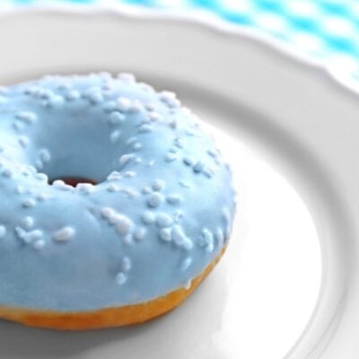 Blue donut on a white plate to signify a Donuts with Dad event